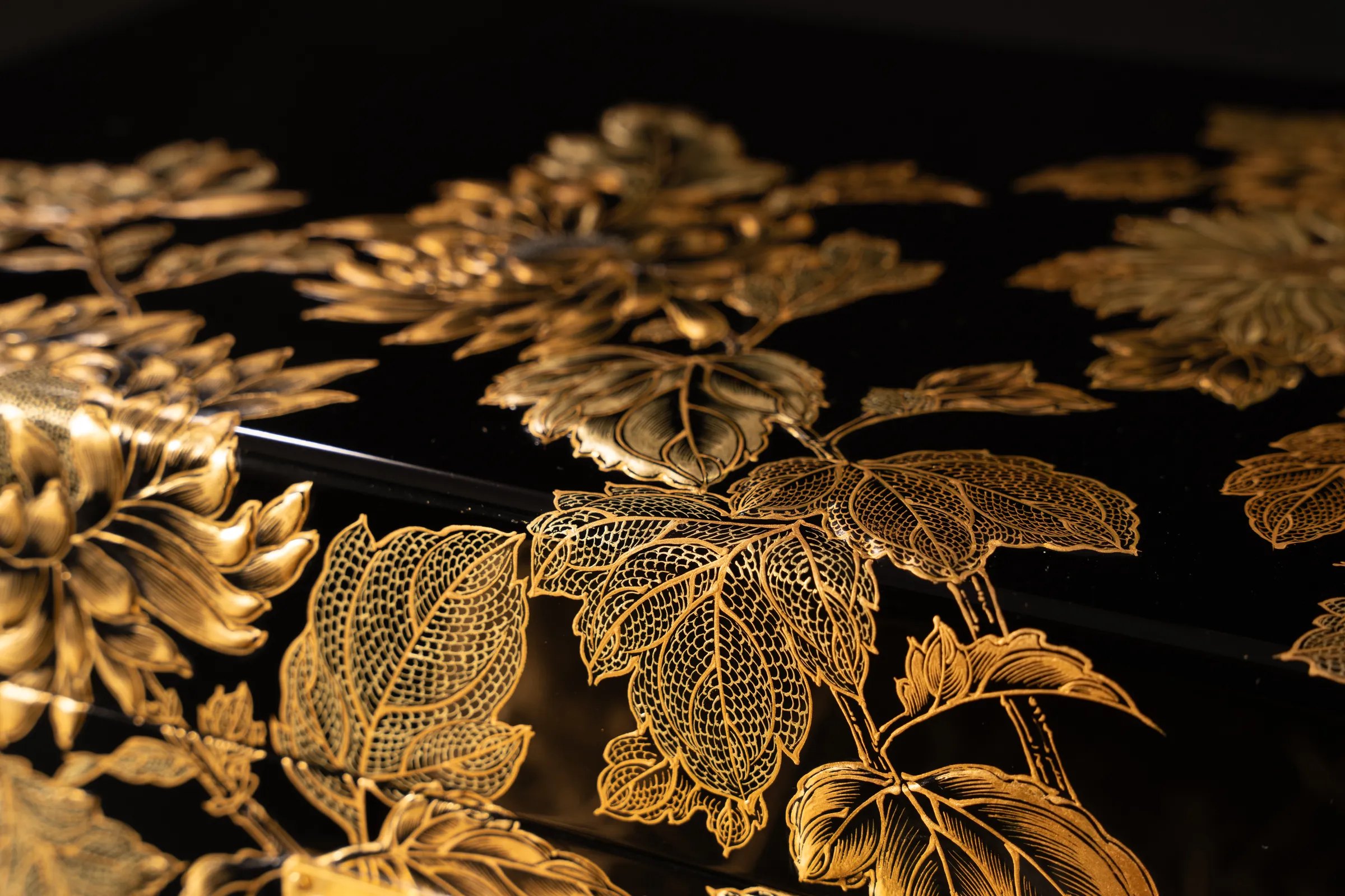 Golden Chrysanthemum Lacquer Urn, gilded chrysanthemums over black lacquer, close detail